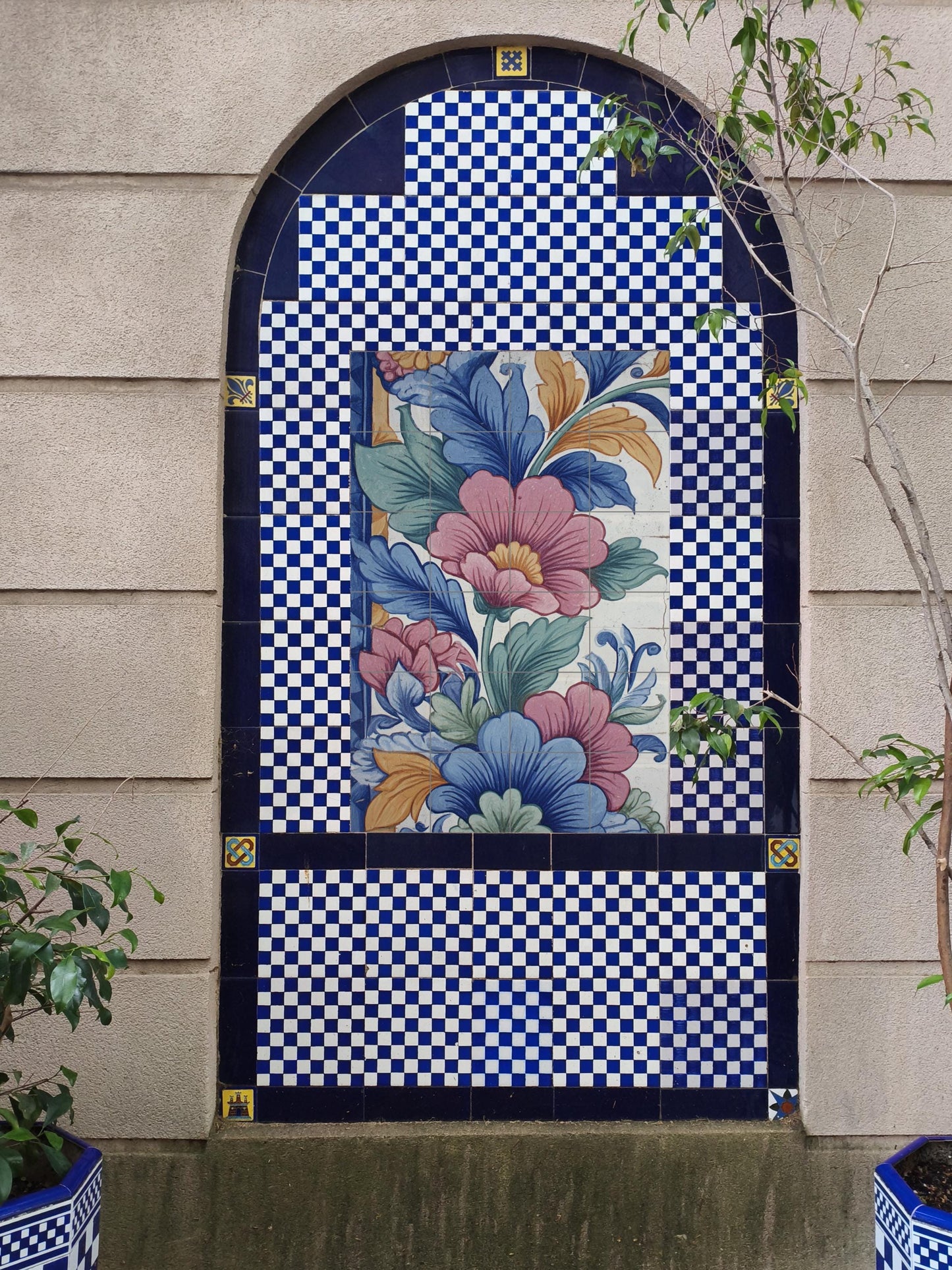 Flourishing Renaissance: Handcrafted ceramic mural with vibrant flowers, artistic foliage and Mediterranean decorative elegance.