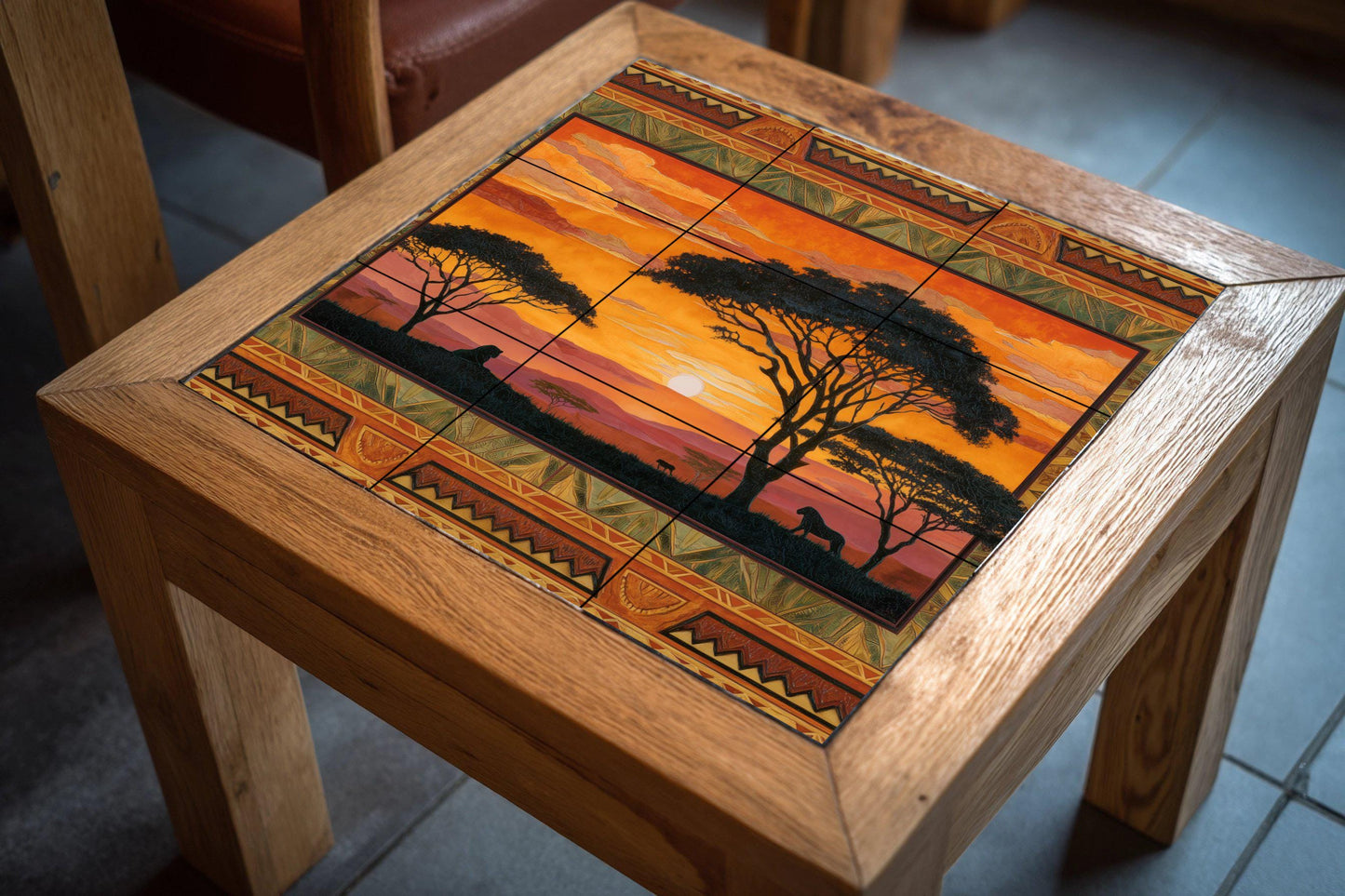 "Sunset in the Savannah" tile mural: African wildlife mosaic with lions and tribal border for kitchen, cabin or a warm interior detail.