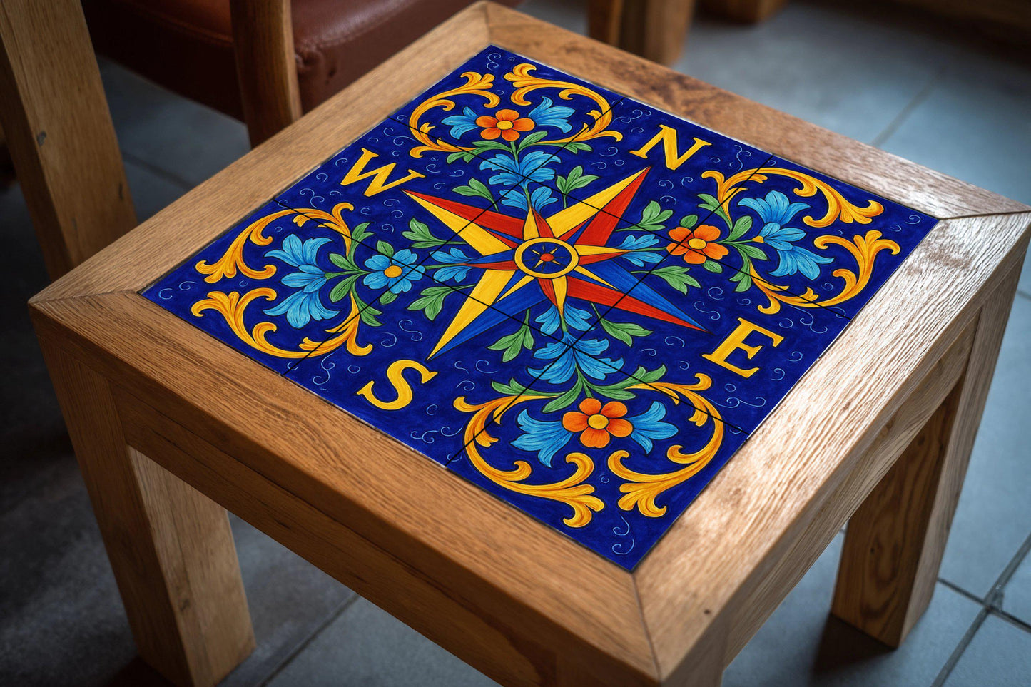 Tile mural with compass rose, Mediterranean ceramic panel, nautical art, blue floral detail for coastal or rustic decoration.