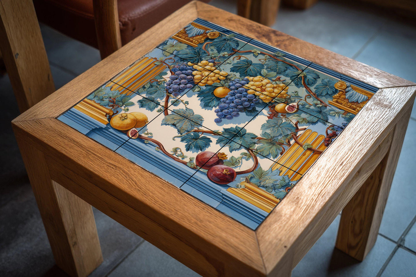 Tile mural with fruit garland: Classic blue and gold ceramic panel featuring grapes, figs, and pomegranates. Roman-inspired wall art for elegant spaces.