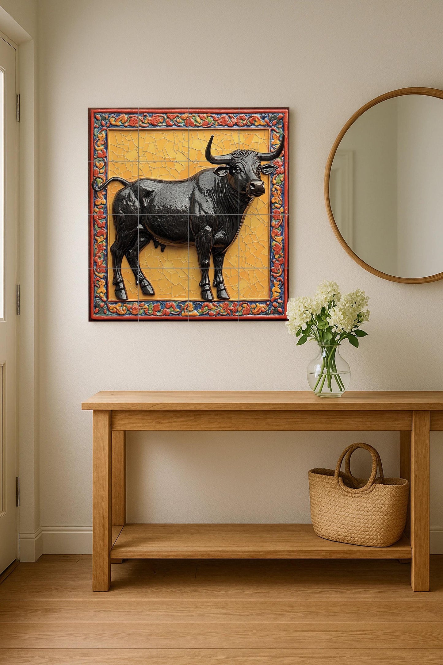 Ceramic mural of a majestic bull: glossy black figure on a gold mosaic background with an ornate border, symbol of strength and legacy.