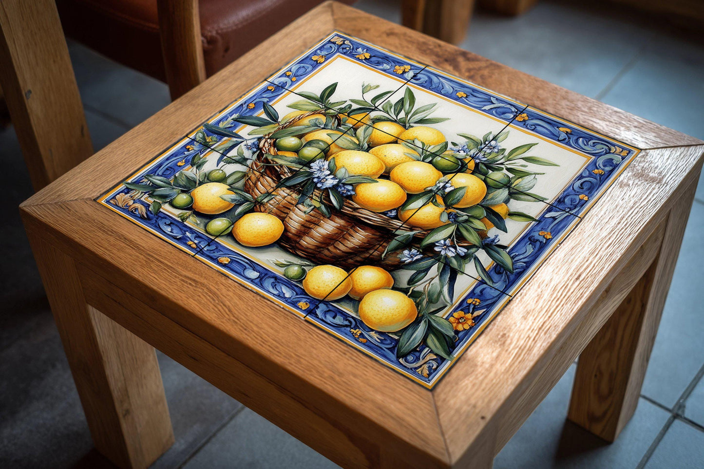 Ceramic mural with basket of lemons and oranges: blue floral border, Mediterranean citrus tile artwork with green leaves and flowers.