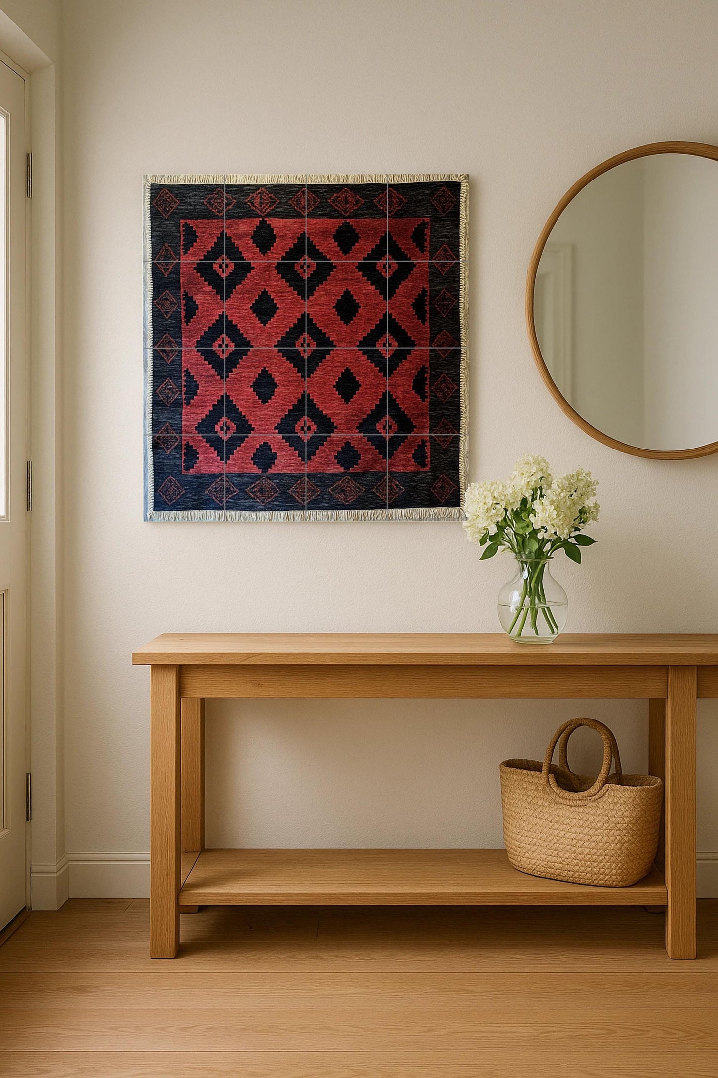 Argentine gaucho poncho ceramic mural with red and black diamond motifs and border pattern inspired by pampa weaving