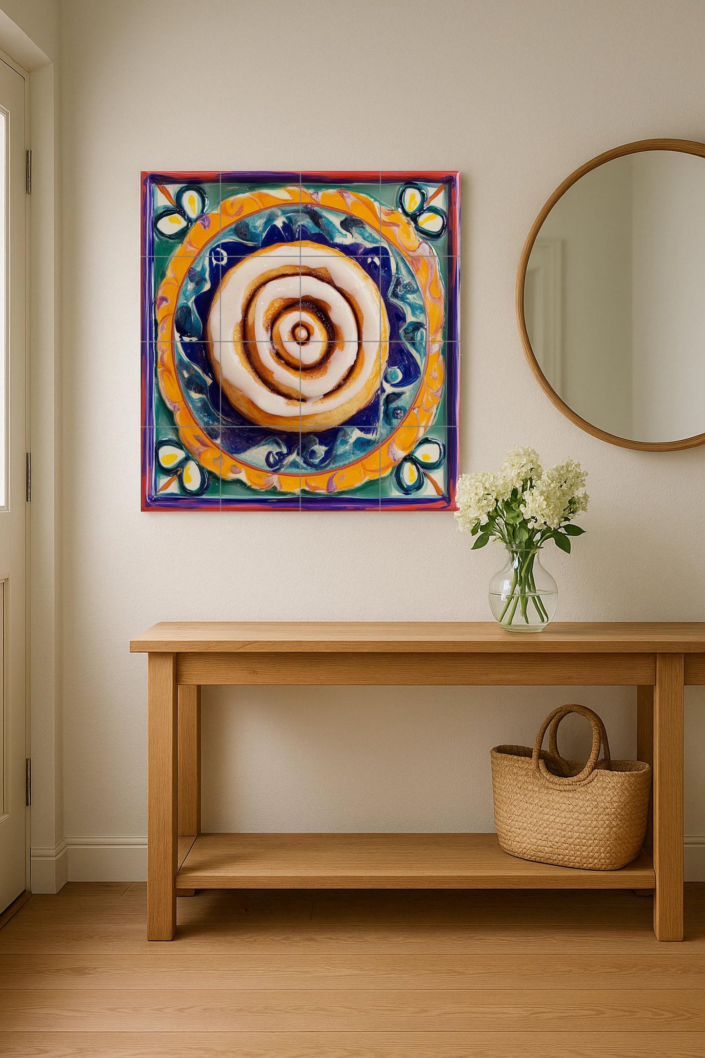 Ceramic mural of cinnamon rolls: figurative sweet pastry with swirl of icing on a vibrant Mexican-style painted plate, colorful decorative tile art.