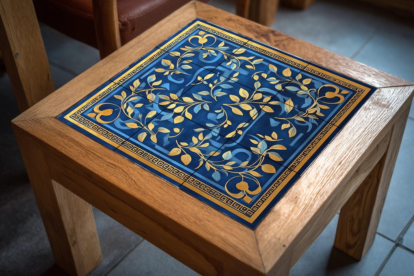 Ceramic mural of laurel and olive with Greek key: blue and gold decorative panel, classic Mediterranean art with tiles and elegant ornamental design.