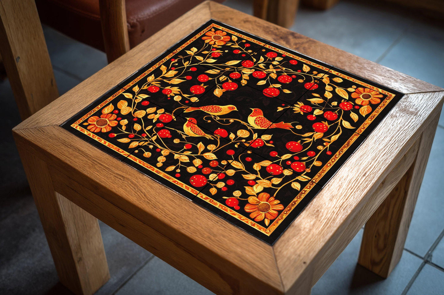 Black and gold ceramic mural: Khokhloma folk-inspired tile artwork featuring red berries, golden birds and ornamental vines.
