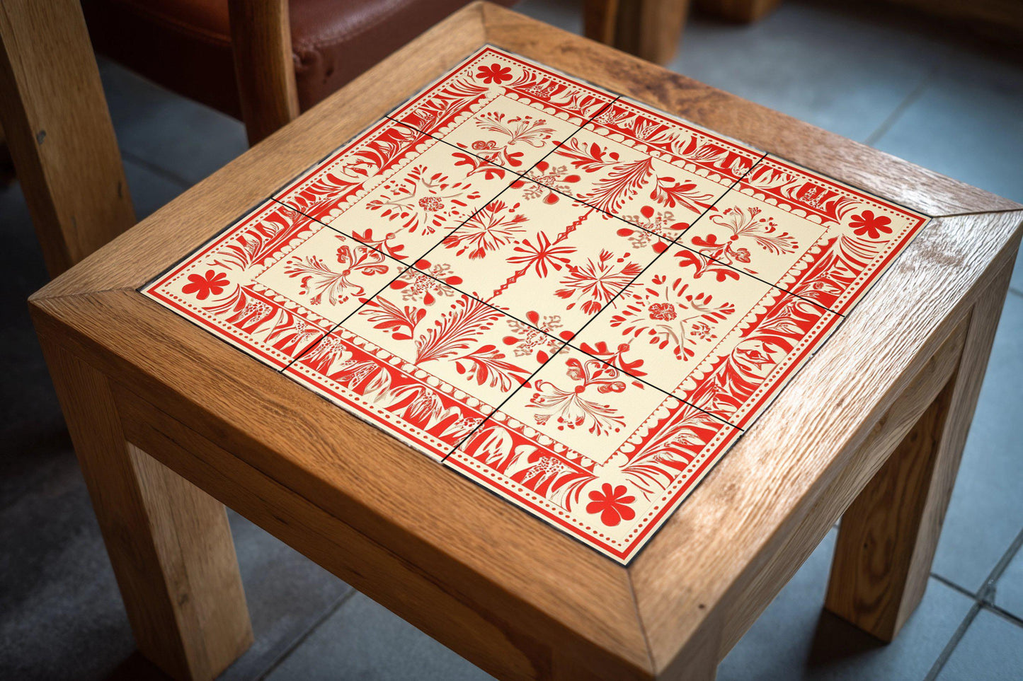 Red and white ceramic mural: Baltic folk-inspired tile artwork with Latvian Lielvārde sash motifs and ornamental textile borders.