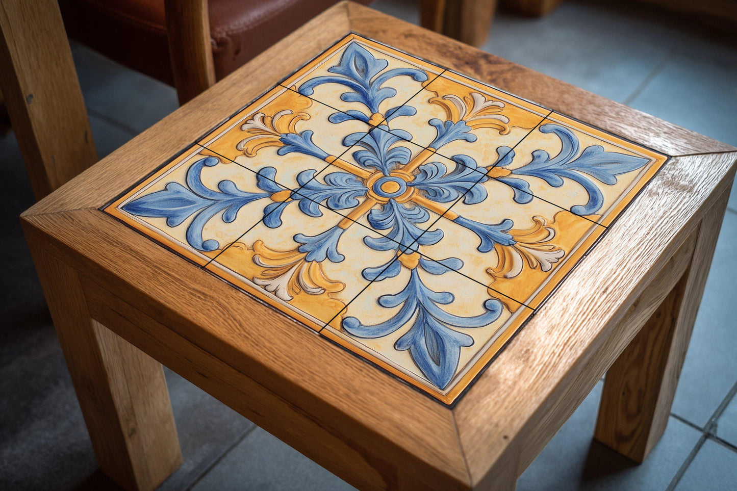 Mediterranean ceramic mural: ornamental art in blue and gold, baroque-inspired wall panel, decorative floral design with scrolls.
