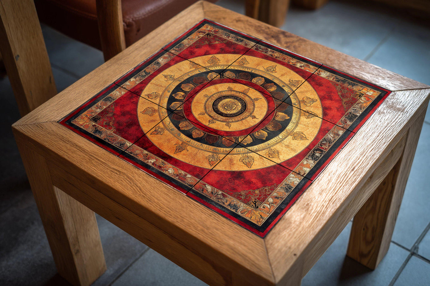 Ceramic mural of Nepalese mandala: sacred Tibetan lotus and cloud border with golden radial symbols in red and black.