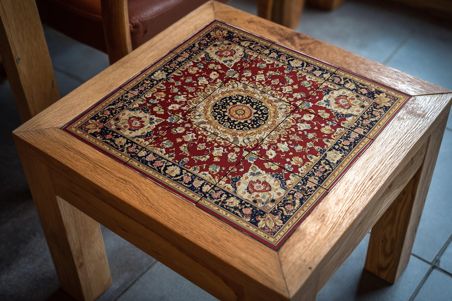 Ceramic mural of Persian heritage: medallion inspired by Tabriz and Mashhad with crimson and navy blue motifs, decorative ornamental tile.