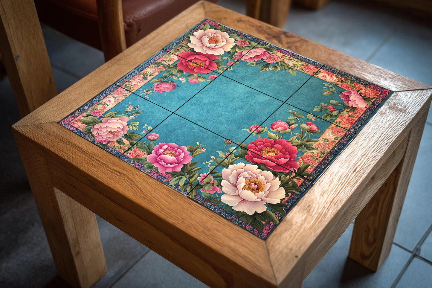 Floral ceramic mural: elegant pink and red flowers with lush vegetation on a turquoise background, ornate tile artwork with decorative border.