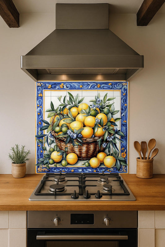 Ceramic mural with basket of lemons and oranges: blue floral border, Mediterranean citrus tile artwork with green leaves and flowers.