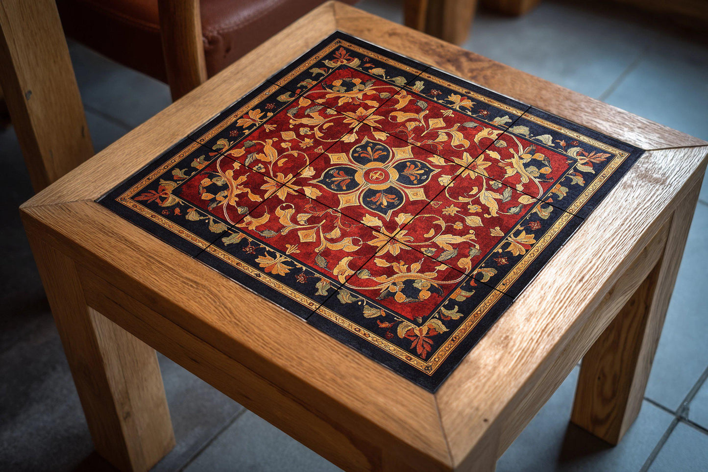 Ornamental ceramic mural with golden floral design and red tapestry: decorative tile artwork of majestic elegance.