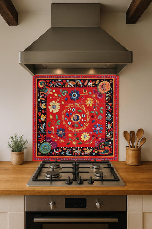 Ceramic mural: floral design inspired by the Nakshi Kantha of Bangladesh, red embroidered motifs with spirals and traditional stitch border.