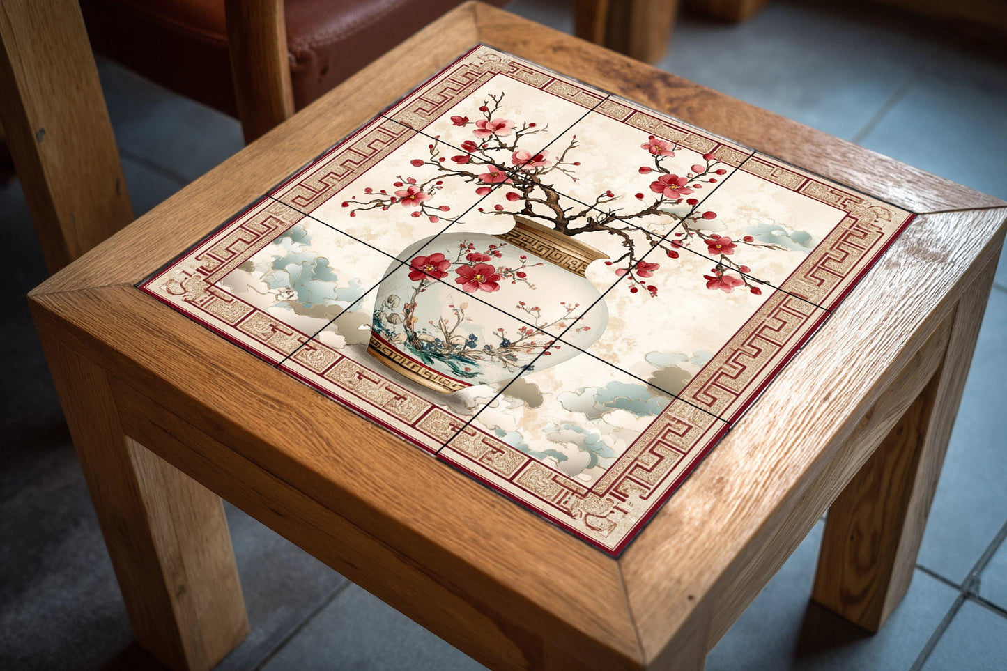 Oriental plum blossom ceramic mural: Chinese porcelain vase with floral motifs, decorative cloud border, elegant handcrafted tile art.