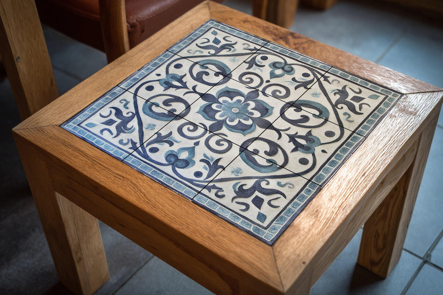 Gray and blue ceramic mural: Kazakh-inspired tile artwork featuring spiral ornamental motifs and a tribal yurt border design.