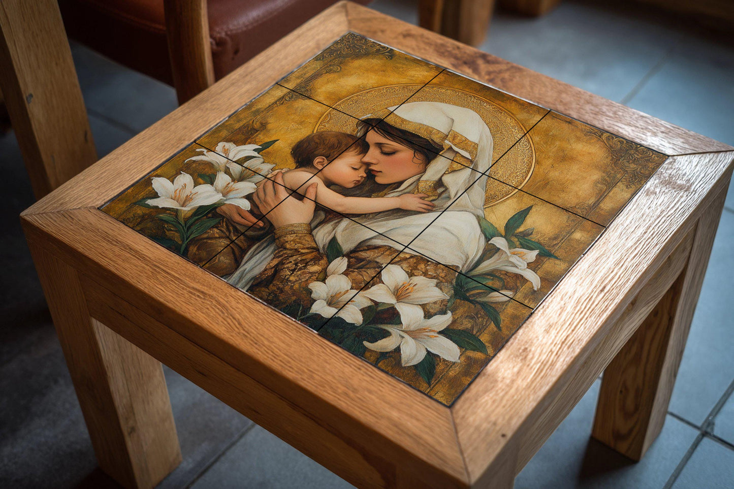 Ceramic mural of the Holy Mother and Child: golden mosaic with embrace, white lilies and ornamental halo, devotional art and timeless religious tile.