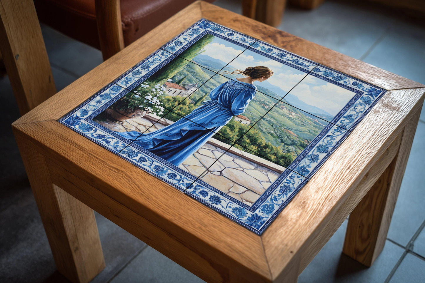 Ceramic mural "The Blue Lady": elegant mosaic with a woman in a flowing dress, terrace view, rolling hills, ornamental floral border and scenic tiles.