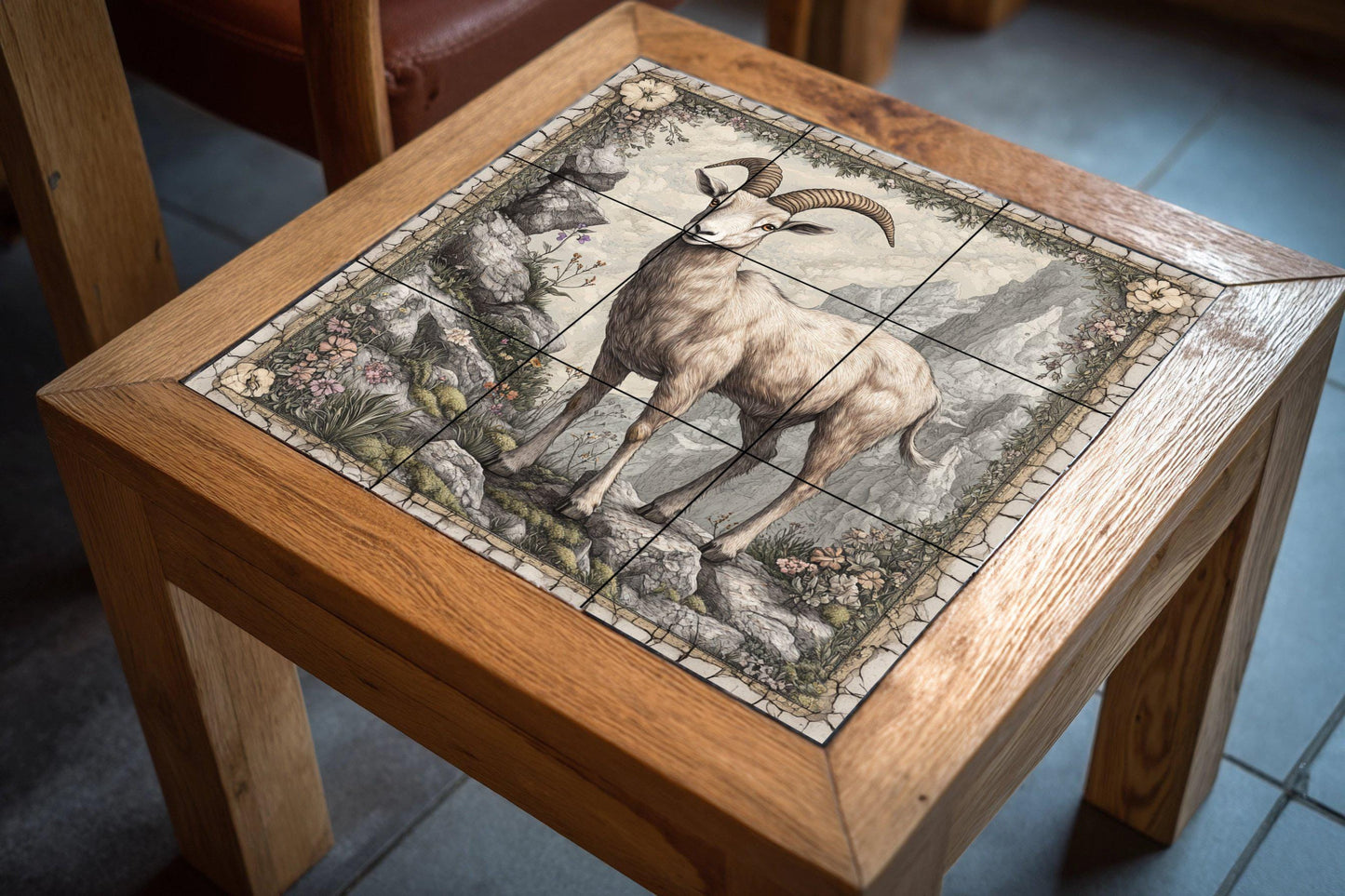 Ceramic tile mural featuring a mountain goat on a rocky cliff, alpine wildlife art panel with detailed horns, floral stone border, rustic wall mural