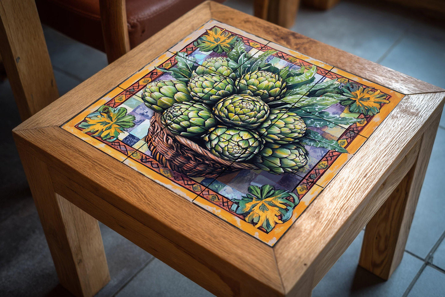Ceramic tile mural with basket of fresh artichokes and decorative wall art panel with detailed leaf arrangement