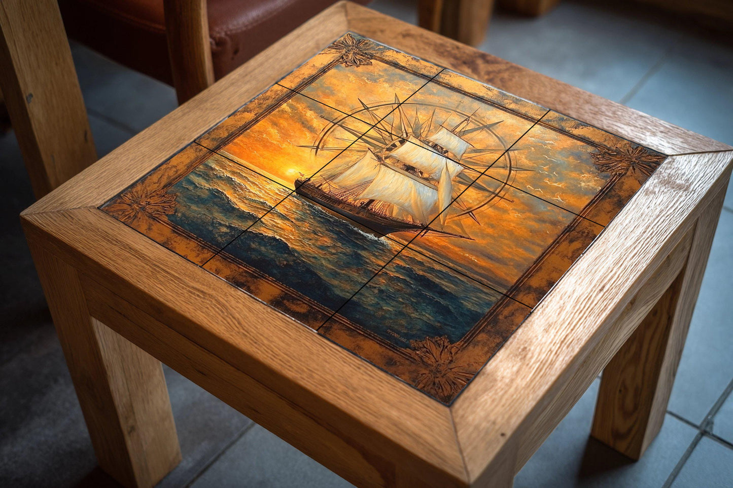 Ceramic wall mural featuring a tall sailboat and compass rose design with ocean waves at golden sunset, nautical sailboat tile art, handmade maritime heritage