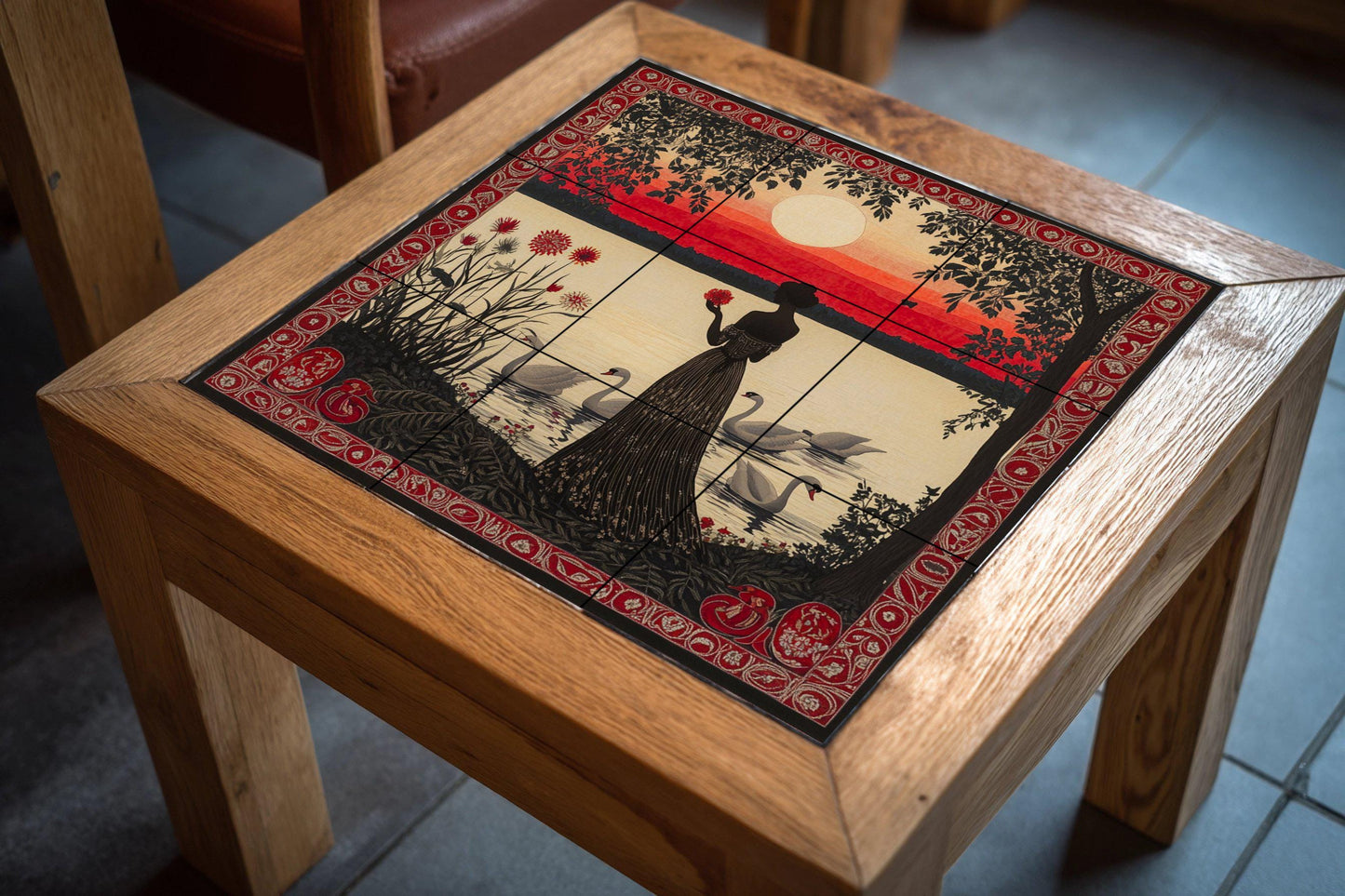 Crimson twilight ceramic mural: silhouette of a woman with swans at sunset, ornate red ornamental border and decorative wall art by the lake.