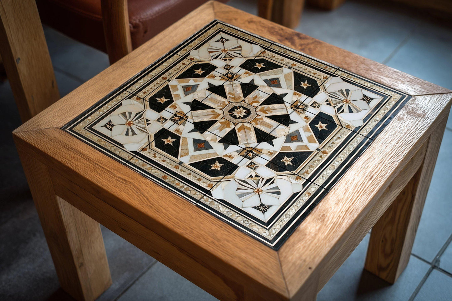 Geometric Star Ceramic Mural: Ornamental panel of black, white and gold tiles with an intricate symmetrical design, luxury wall art centerpiece