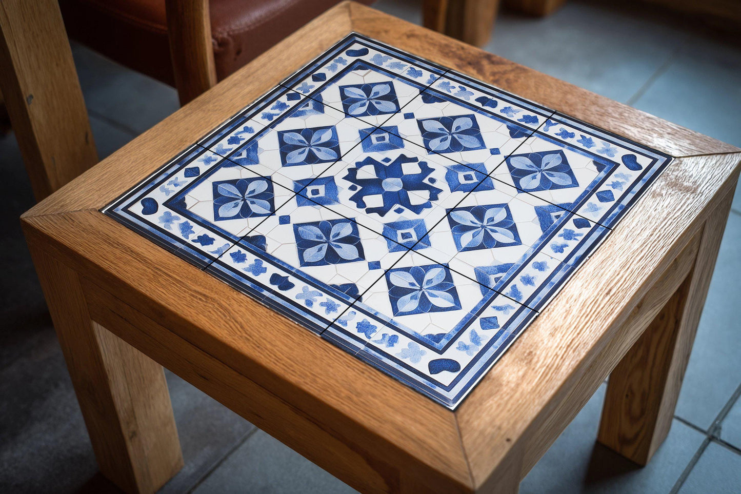 Tunisian ceramic mural: geometric tile art with arabesque border, hand-painted Mediterranean wall panel, handcrafted decoration.