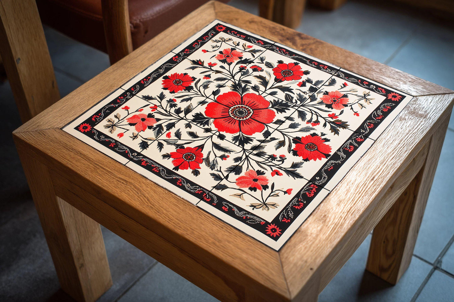 Ceramic mural with Ukrainian embroidery: floral art on red and black tiles with folk stitch border, traditional Slavic heritage mural decoration.