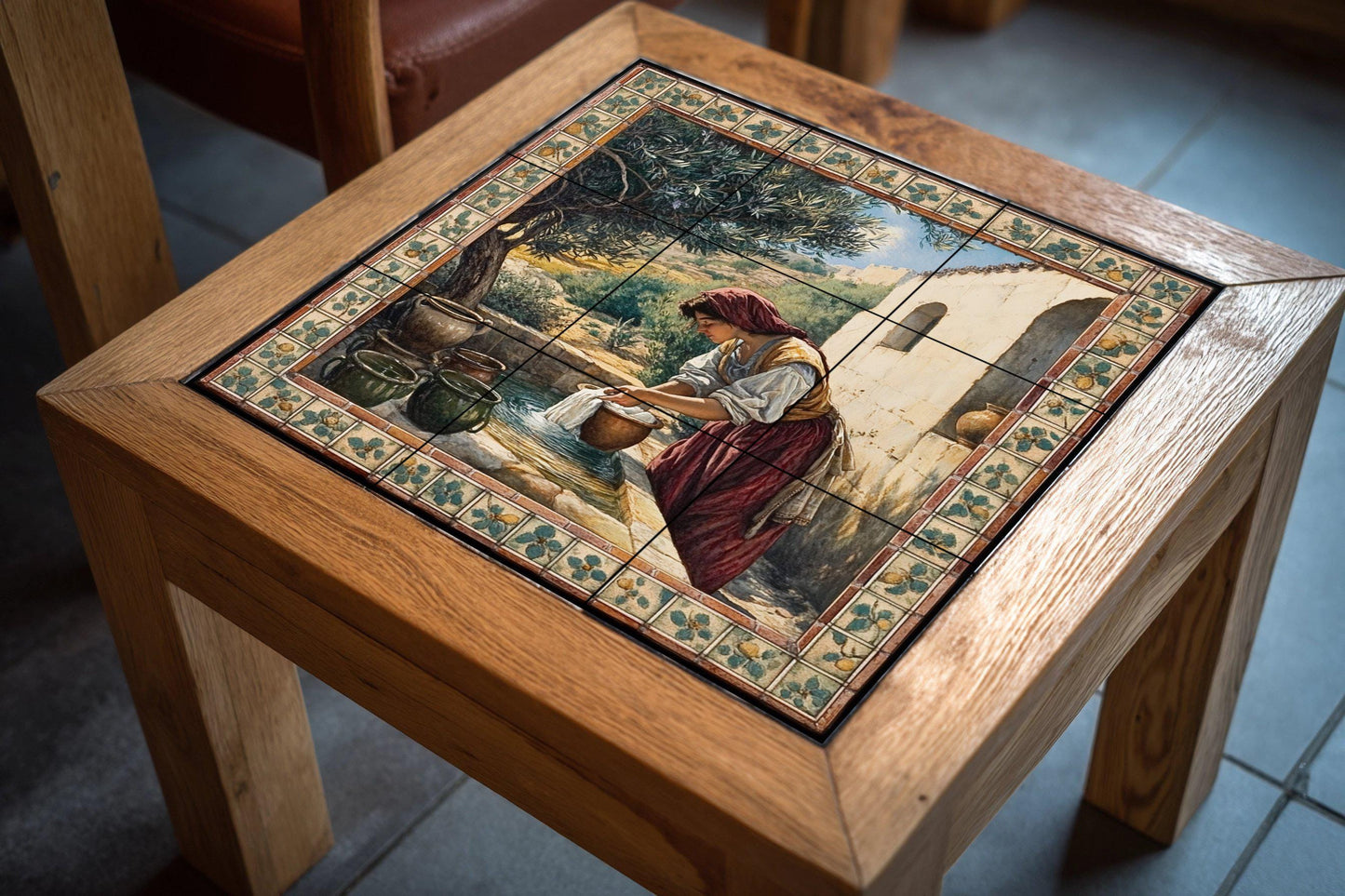 Rustic ceramic mural next to a well: country mosaic with a woman washing a cloth, an olive tree, clay pots, a stone wall and a work of art with pastoral-style tiles.