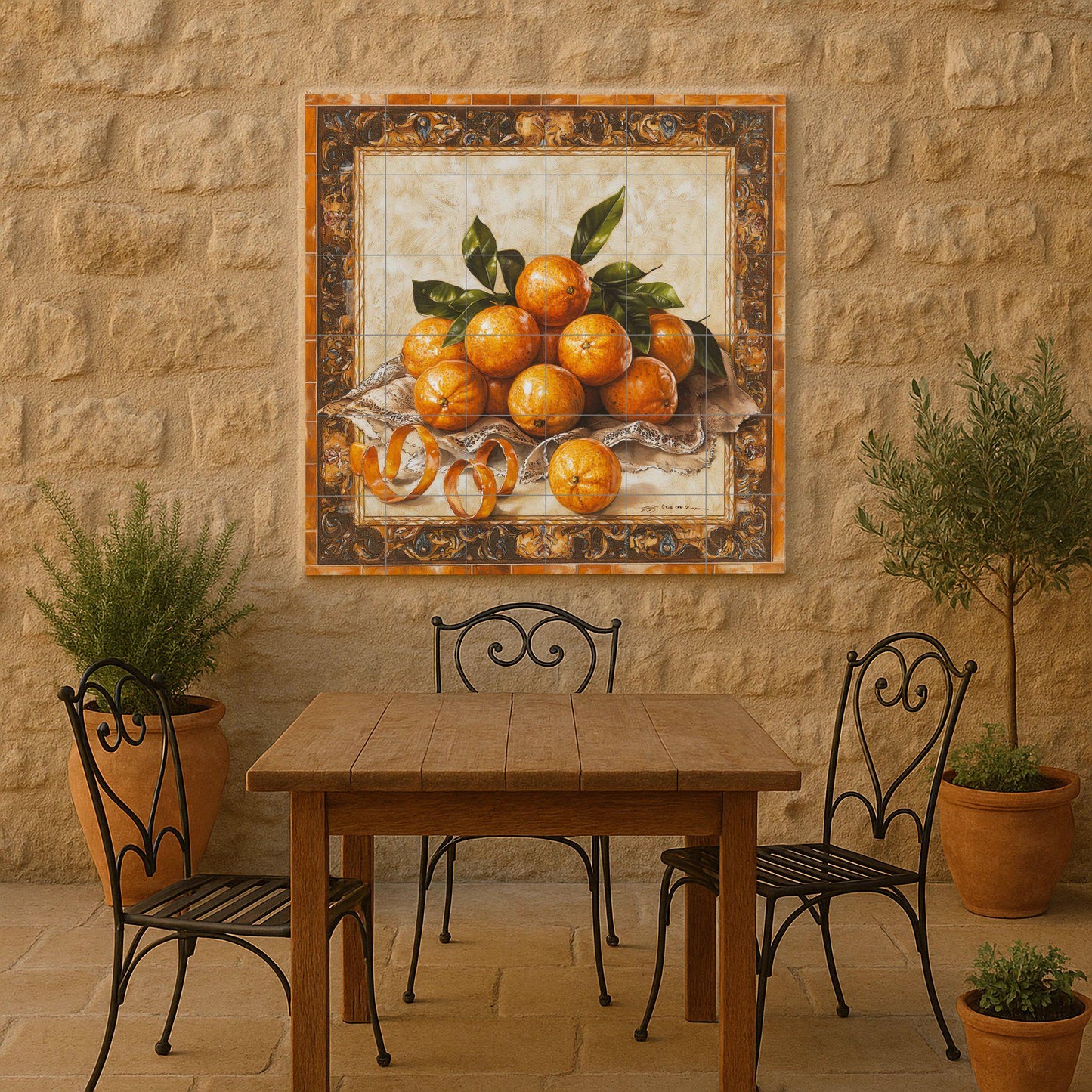 Ceramic tile mural with oranges, curled peels, lace fabric and decorative wall art panel with fruit still life and ornate baroque border.