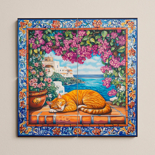 Ceramic tile mural with orange cat sleeping on terracotta tiles, view of a Mediterranean coastal village, bougainvillea and ornate floral border.
