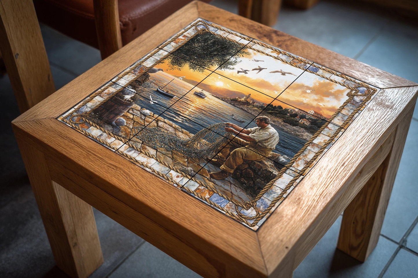 Ceramic tile mural featuring a fisherman repairing a net by the sea, coastal scene at sunset with boats and seagulls, wall panel with rope stone border