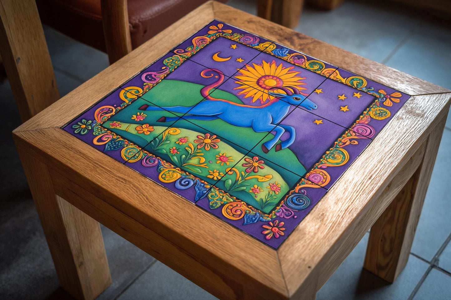 Colorful folk art ceramic tile mural / Vibrant blue goat with sun and stars / Mexican-inspired decorative panel