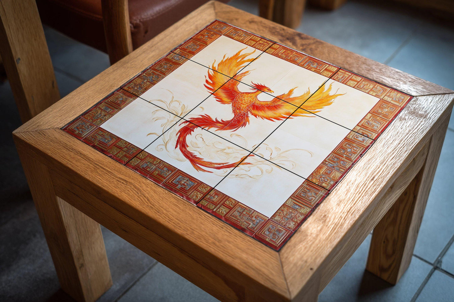 Ceramic wall mural of a phoenix with a fiery mythological bird and red ornamental border, legendary renaissance tile art, handmade cultural decoration