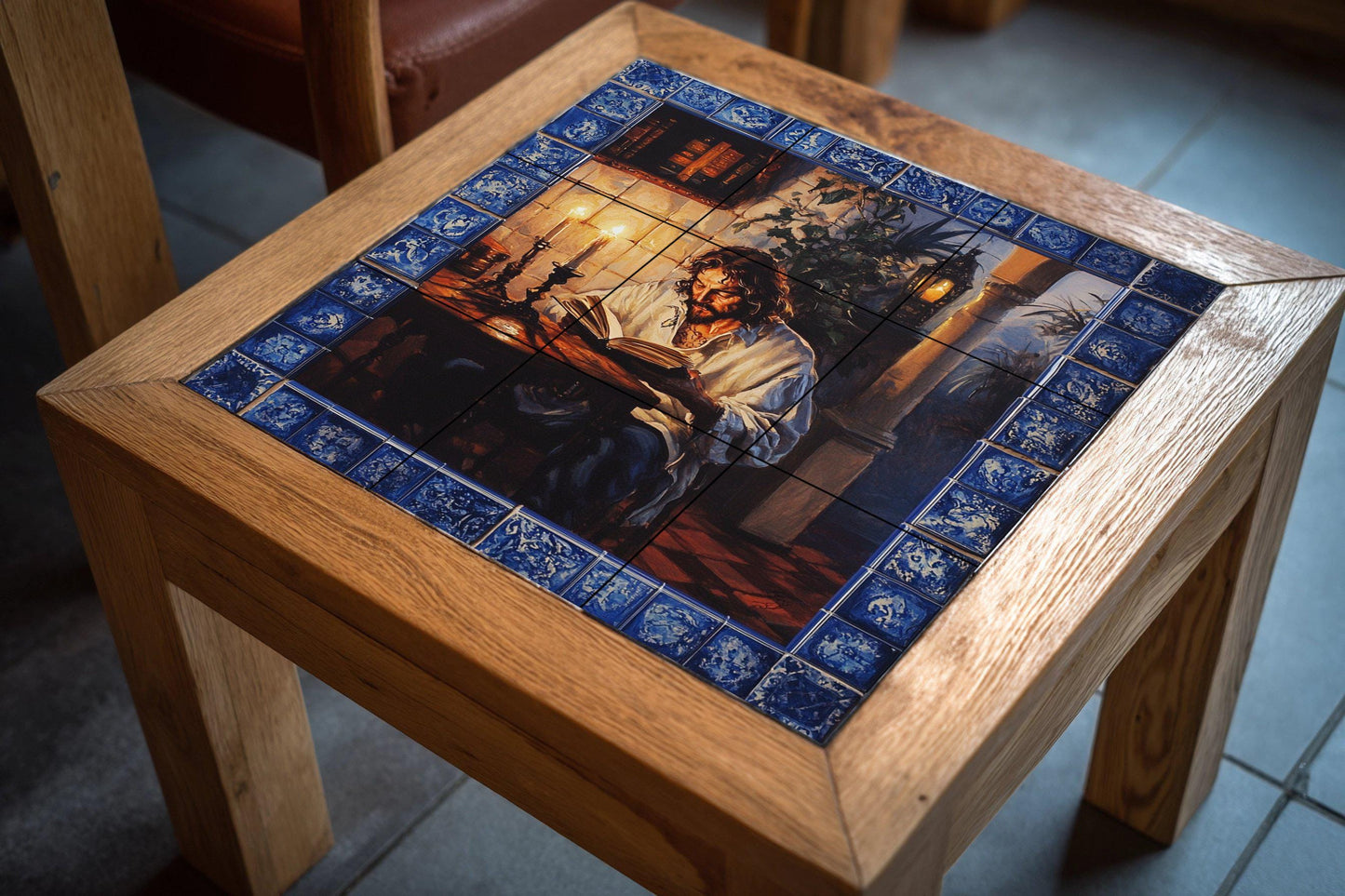 Classic ceramic wall mural featuring a man reading by candlelight, vintage art with a blue tile border, handmade historical literary home decor