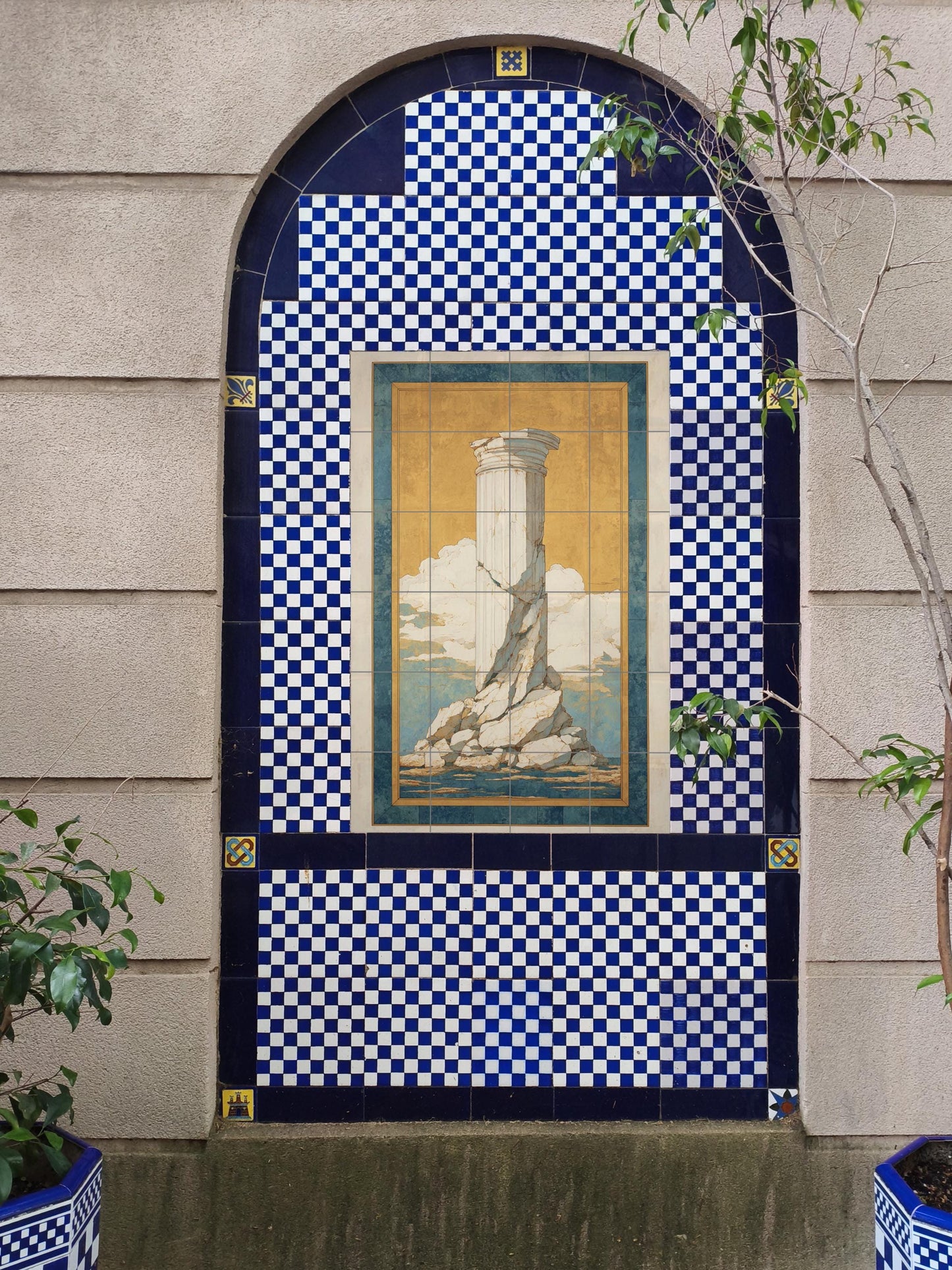 Echoes of Antiquity: Ceramic mural with classical columns, artwork with Mediterranean tiles featuring a golden sky and blue horizon, architectural elegy