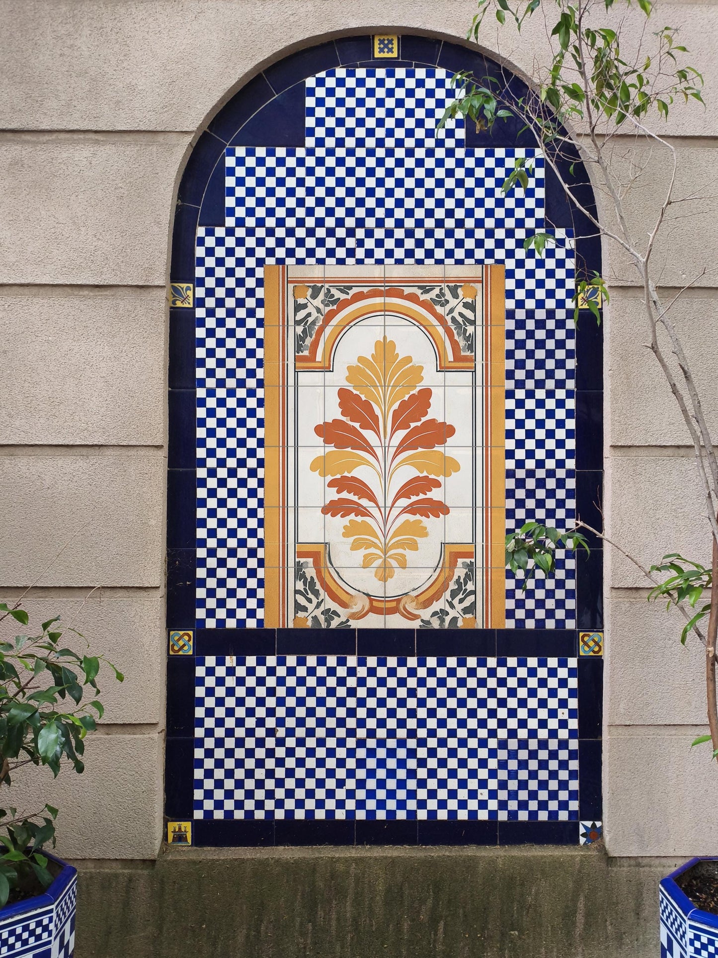 Madrid ornament: classic ceramic mural with golden symmetry, warm terracotta tones and refined architectural grace.